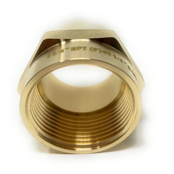 1-1/4" x 1-1/4" lead-free pipe adapter, highlighting its precision-engineered threads for secure fittings