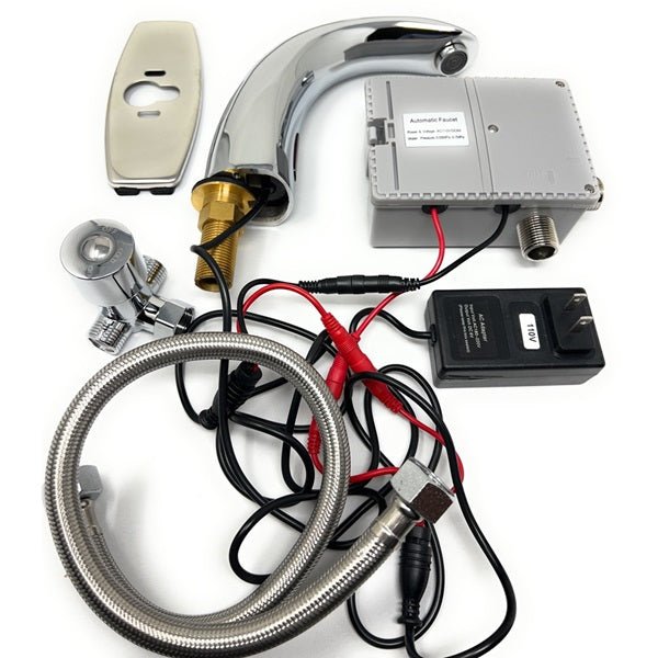 Set of parts for an automatic faucet including a chrome spout, control box, power adapter, sensor plate, and hoses.
