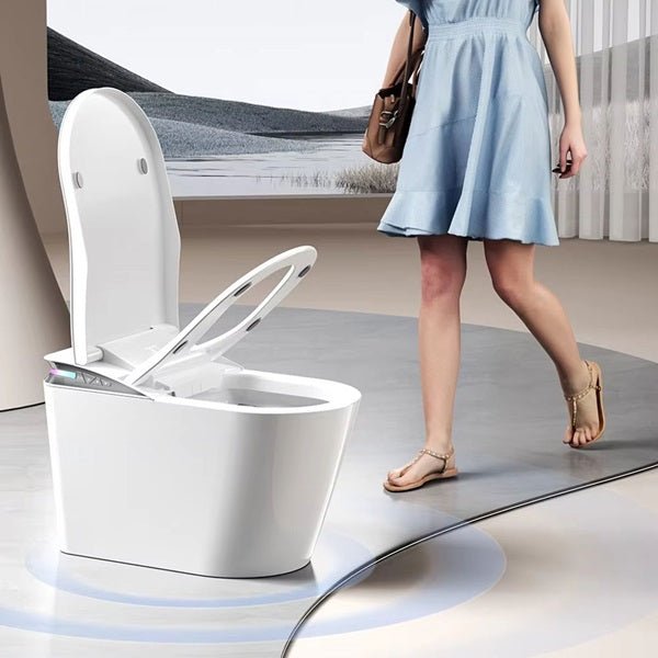 Modern white toilet with a woman in a light blue dress walking in the background