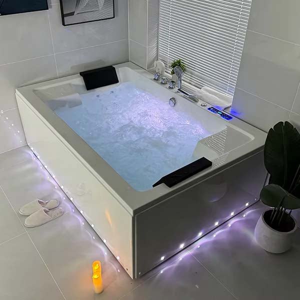 Dual-person acrylic whirlpool bathtub with LED lights and ergonomic headrests