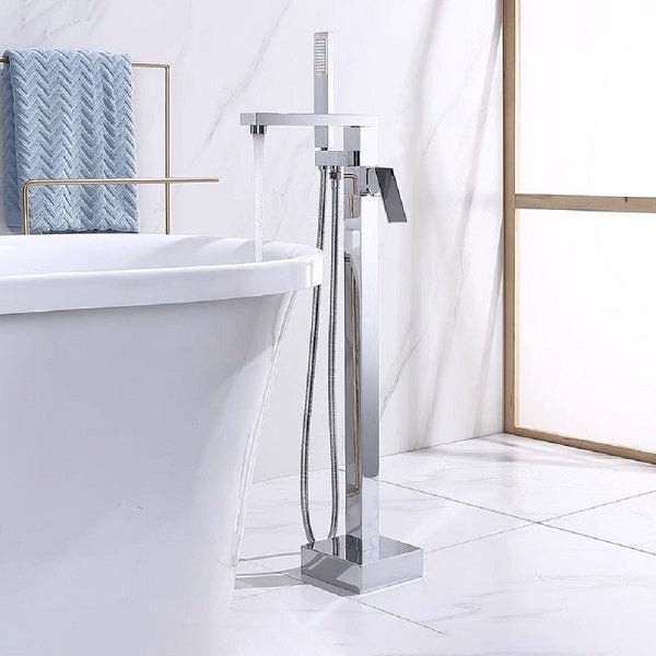Chrome freestanding bathtub faucet with handheld shower head in a bathroom setting.