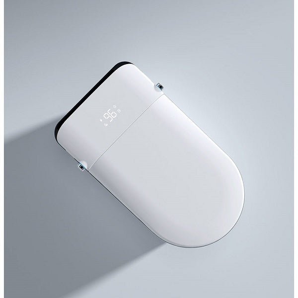 White electronic device with digital display on a gray background