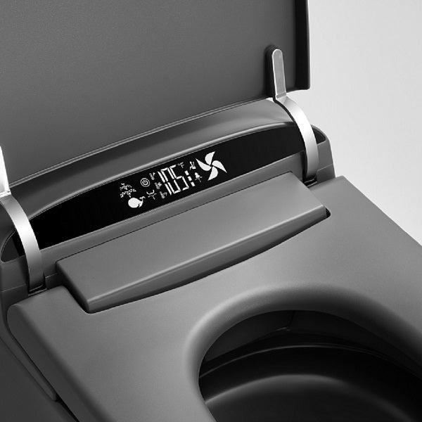 Smart toilet LED control panel illuminated in low-light bathroom showing temperature display and night mode