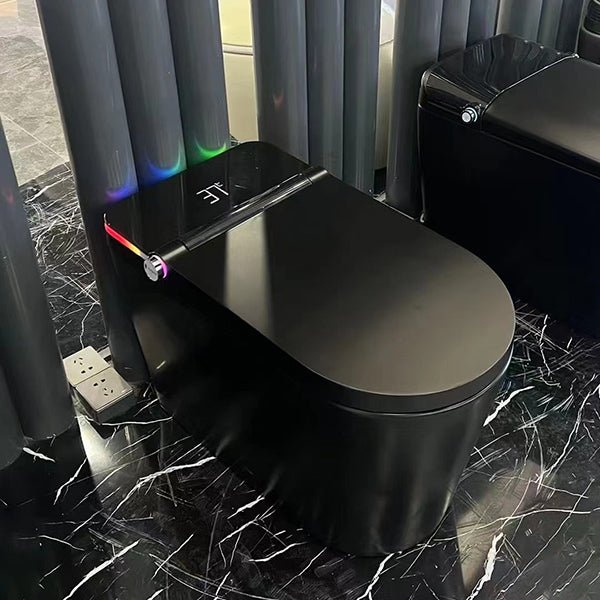 Modern black toilet with colorful light accents in a bathroom setting.