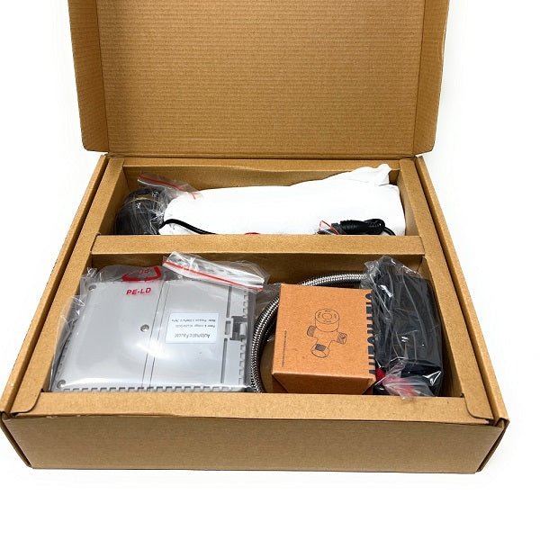 Open cardboard box containing electronic components and accessories