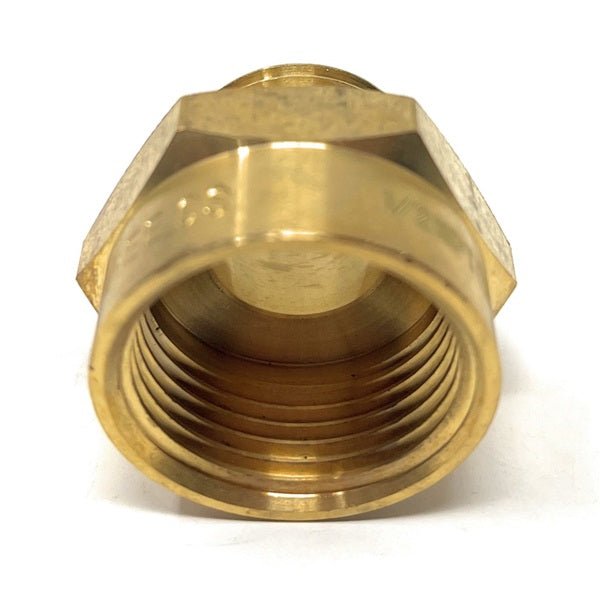 Brass pipe fitting on a white background