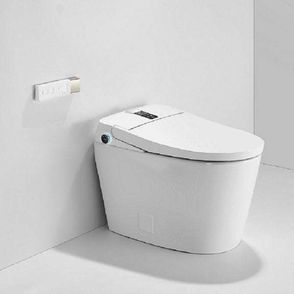 Modern white smart toilet installed in contemporary bathroom with heated seat and auto flush